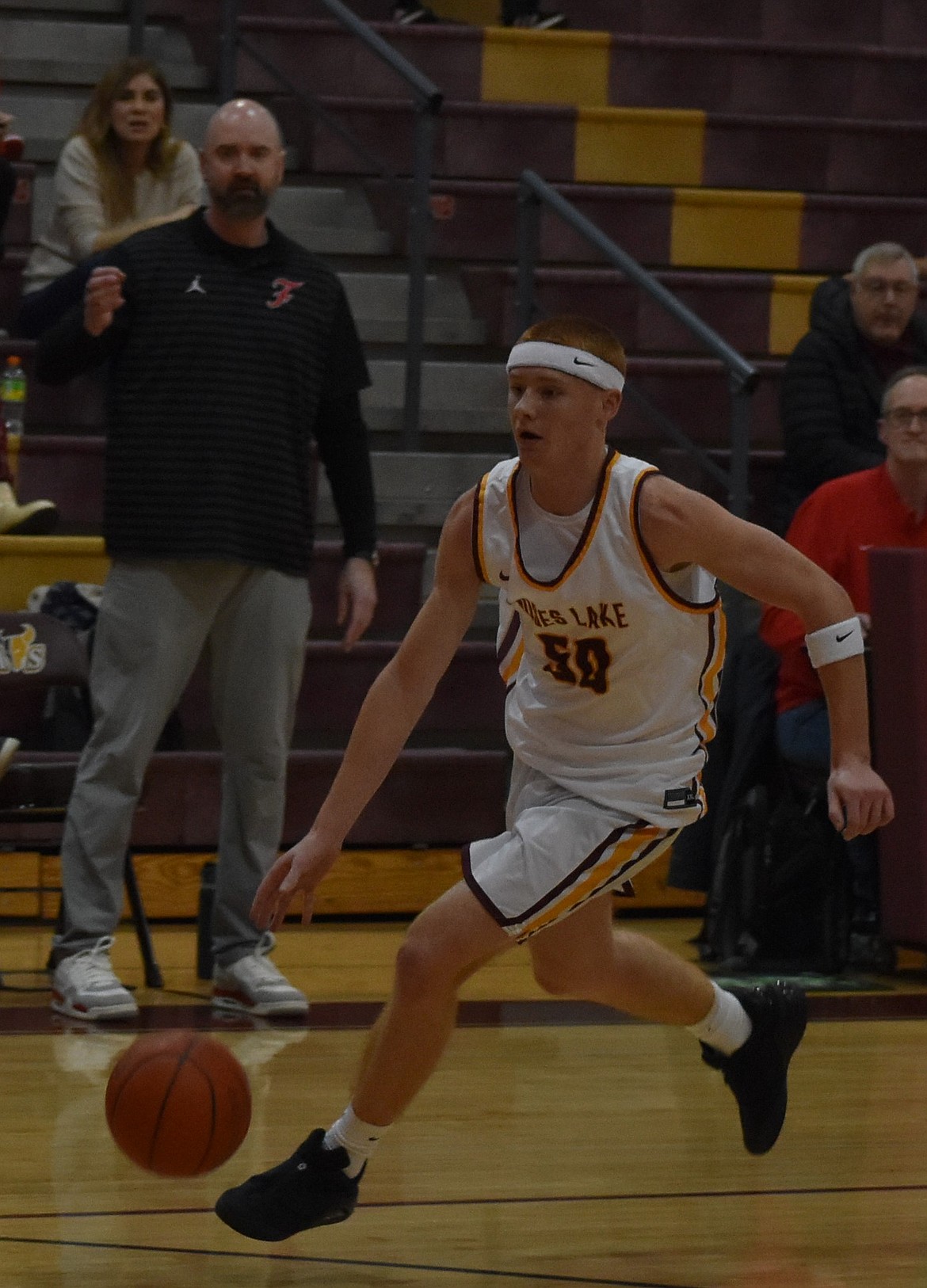 MLHS senior Kyre Wiltbank weaves through defending Ferris players as he goes in for the layup during Friday’s matchup.