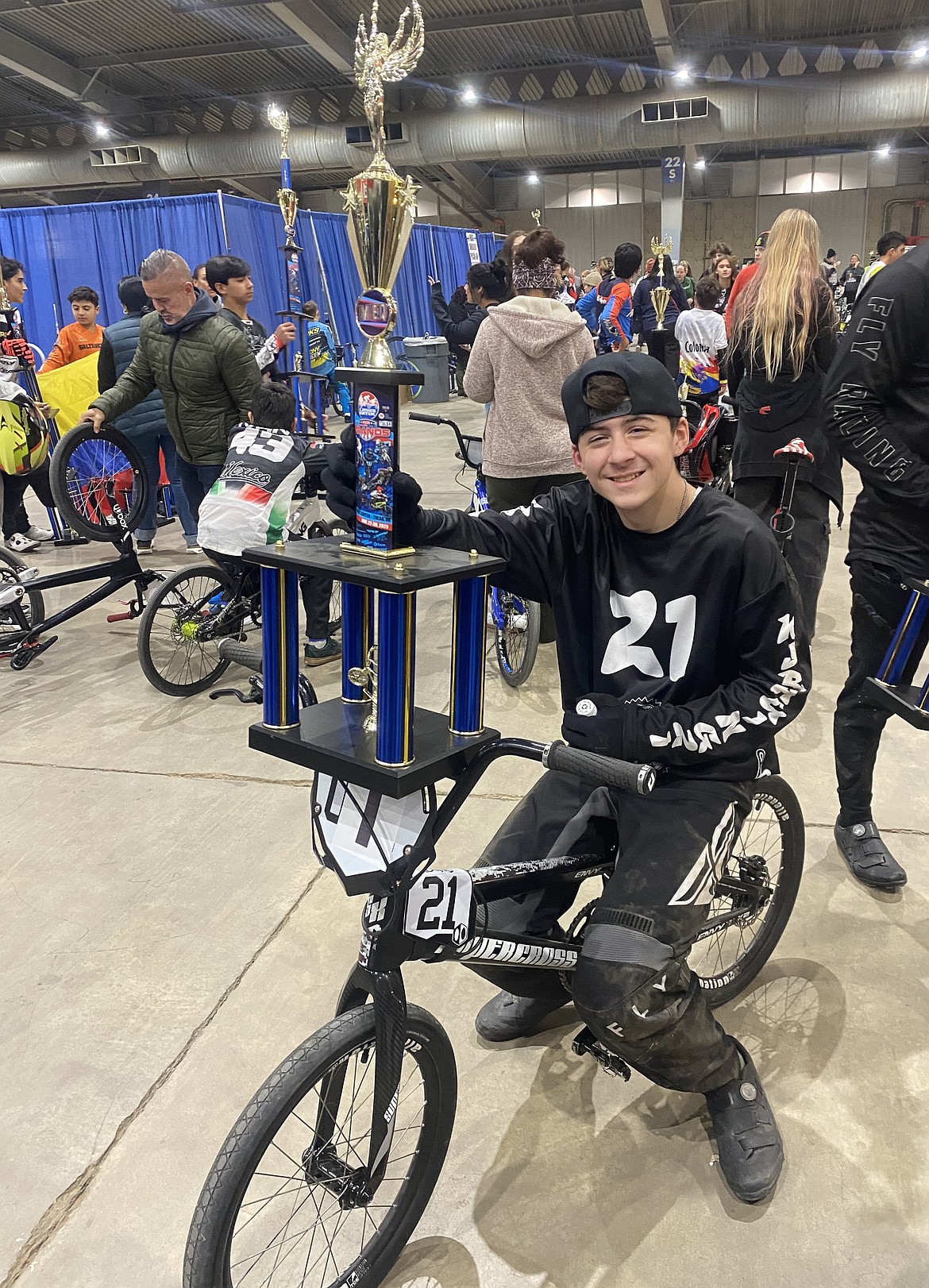KJ Gilman (21) poses with his trophy that he won at the USA Grand Nationals race in Tulsa, Oklahoma. Gilman said he was invited to compete in the Race of Champions since he was a top performer in Washington’s 13 intermediate group.