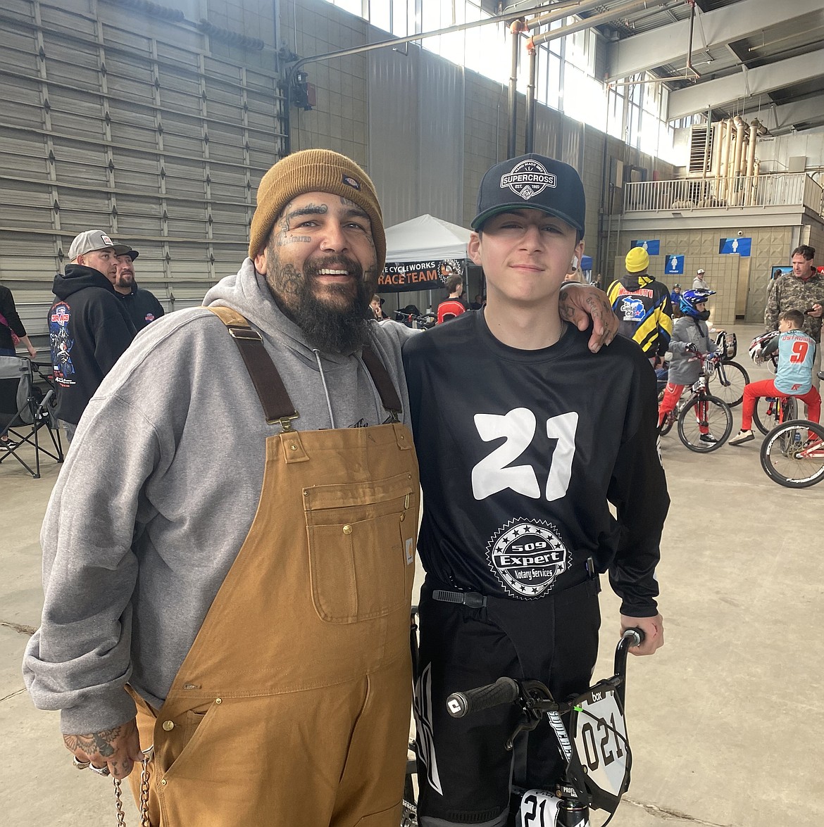 KJ Gilman, right, and his dad Joe Ornelas, left, take a photo together at the USA Grand Nationals race in Tulsa, Oklahoma. Gilman said he has aspirations of becoming a pro in BMX one day.