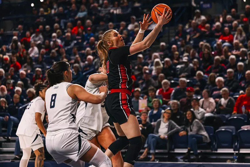 The Eagles’ Jaecy Eggers (10) puts up a layup shot after driving through defensive traffic. Eastern Washington defeated South Dakota 67-63 on Saturday.