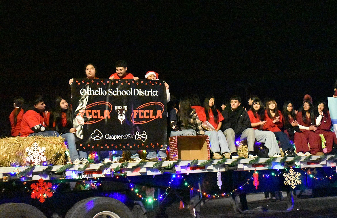 Othello High School students ride in the Miracle on Main Street parade Saturday.