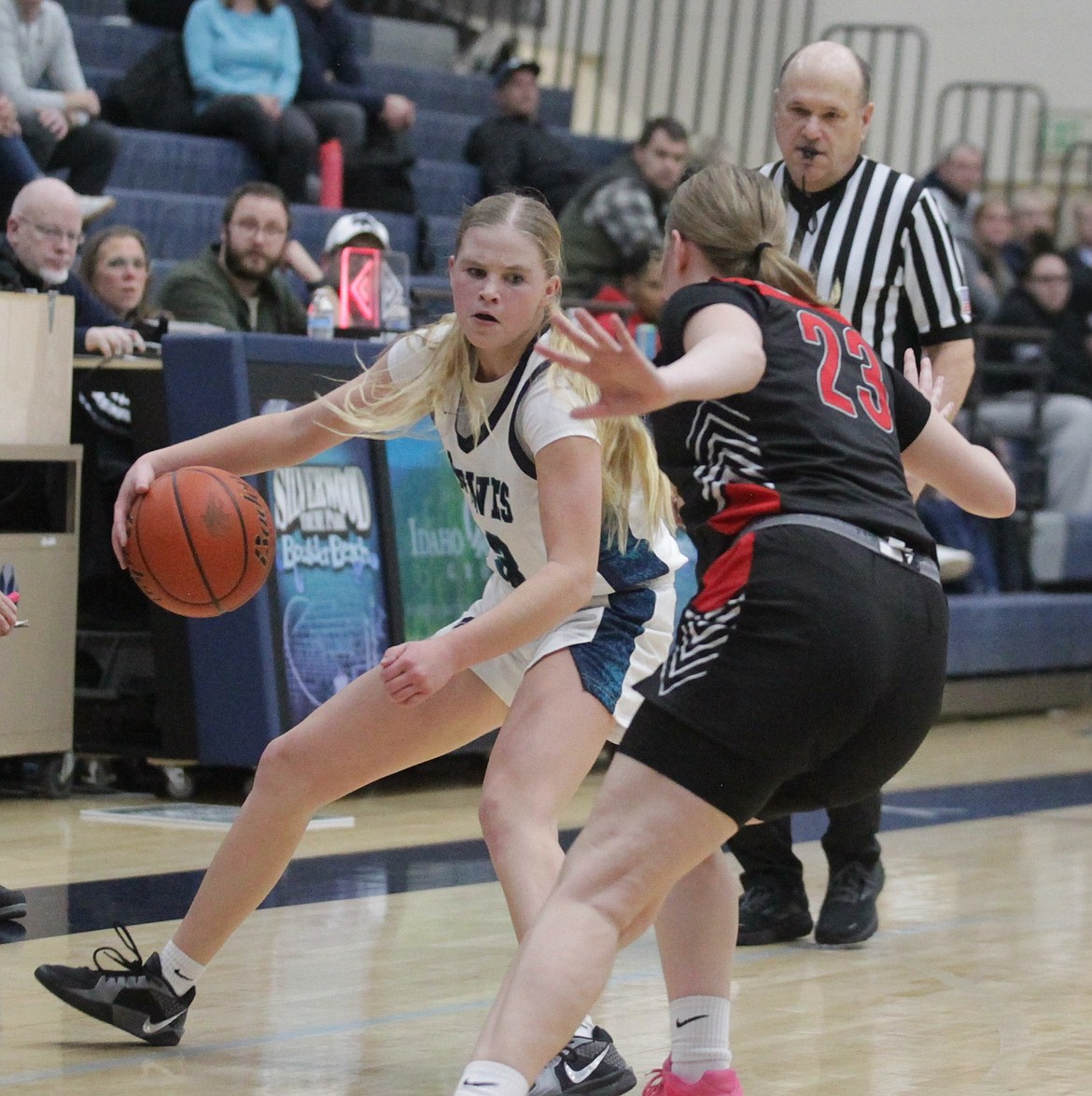JASON ELLIOTT/Press
Lake City freshman freshman Brynlee Johnston looks to drive past North Central senior Natalie DeLeon during the second quarter of Tuesday's game at Lake City High School.