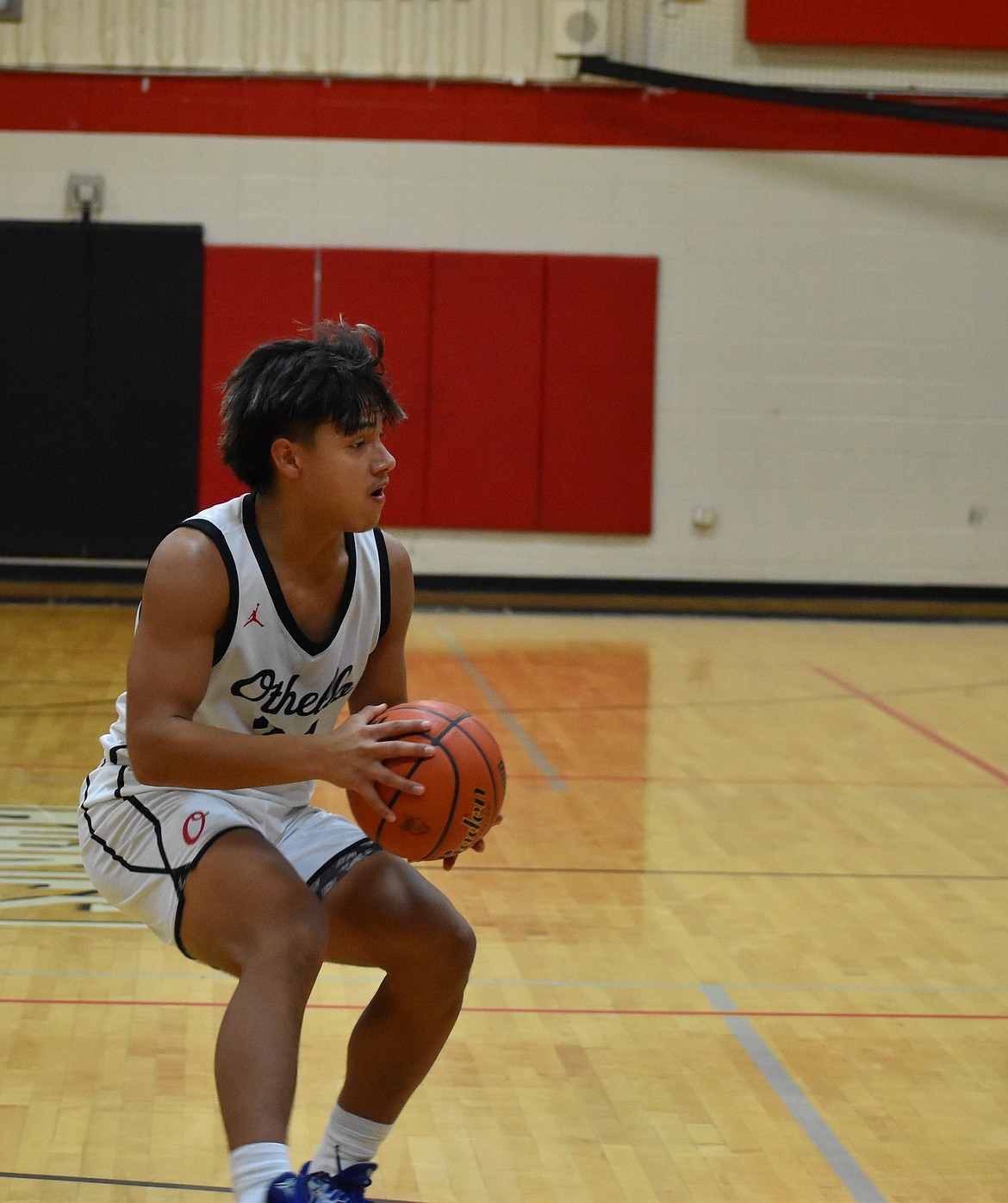 Senior Luis Farias Villanueva from OHS stops to pass to a teammate after the opposing Sageview defense puts up a block.