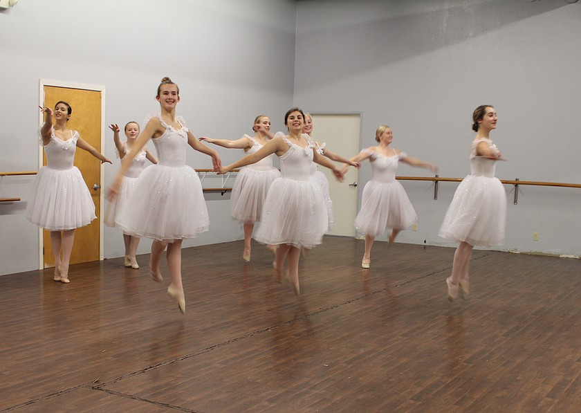 Dancers take to the air in a previous rehearsal for the Ballet Academy of Moses Lake’s performance of “The Nutcracker,” returning Saturday.