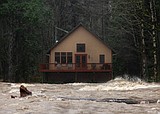 Record flooding threatens Washington as more heavy rain pounds the Northwest