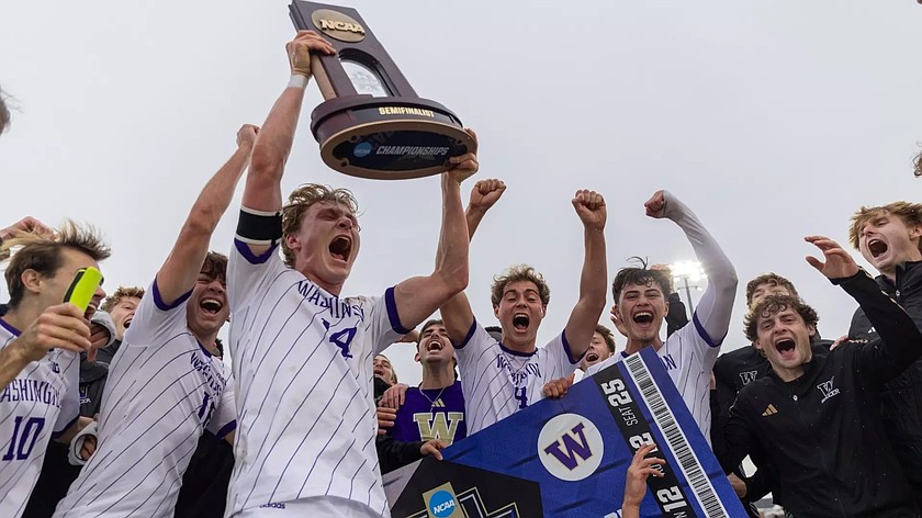 The Huskies hold up their trophy while celebrating their qualification for the NCAA Semifinals last weekend. UW will face off with Furman on Friday at 3 p.m.