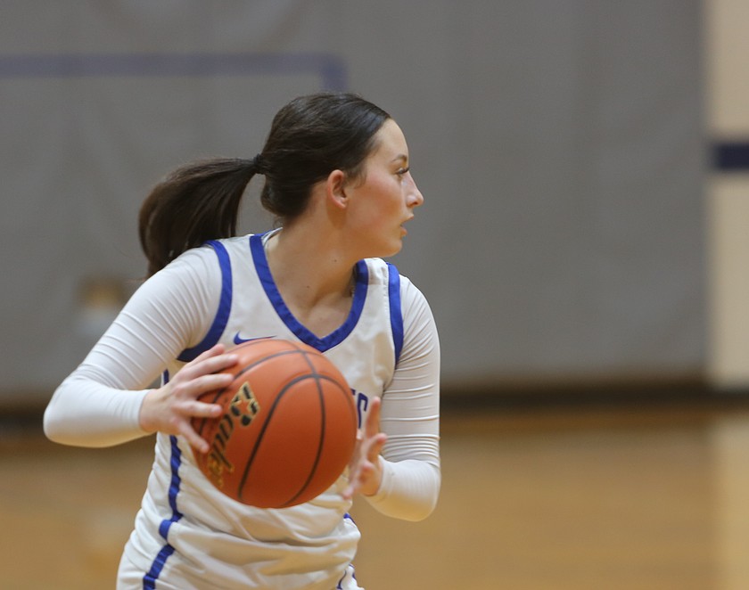 Mylee Dana (1) looks for a teammate to pass the ball to against Cascade Christian Academy on Wednesday. The Eagles defeated the Wolverines 62-24 to earn their first win of the season.