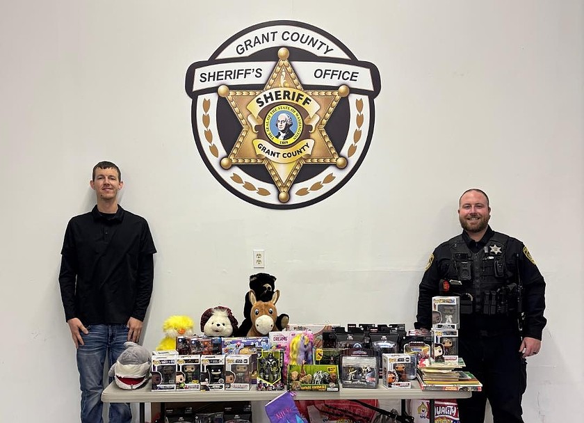 Grant County Sheriff’s Office received a large donation of toys from the Sand Scorpions ORV Group. Scott Fisher, of the ORV Group, left, transferred the gifts to Deputy Sheriff Cody Clark, right. Deputies will be delivering toys this holiday season.