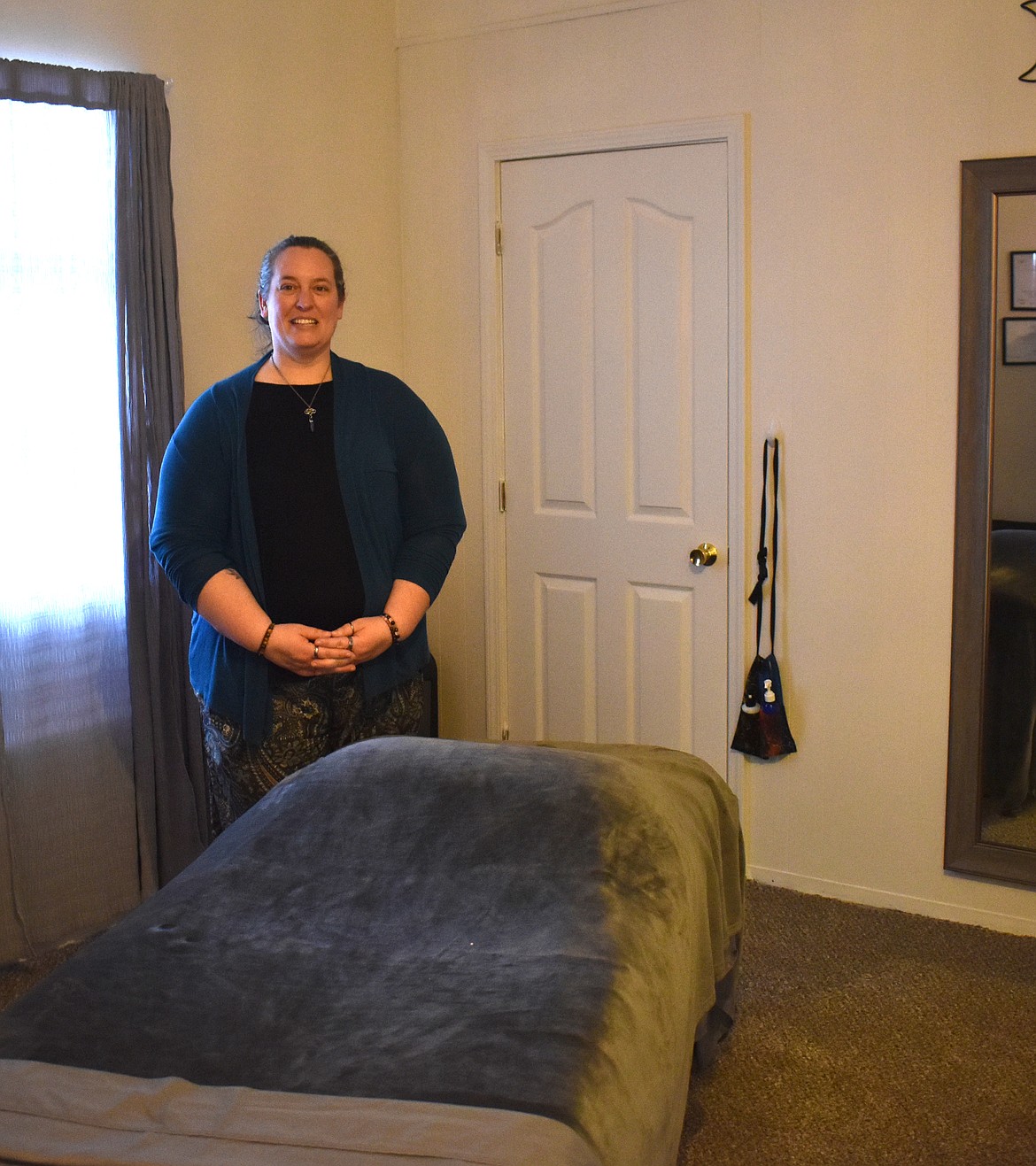 A quiet, gently lit room in the back of the office at 815 W. Third Avenue is where Mandy Schuh does her massage and reiki treatments.