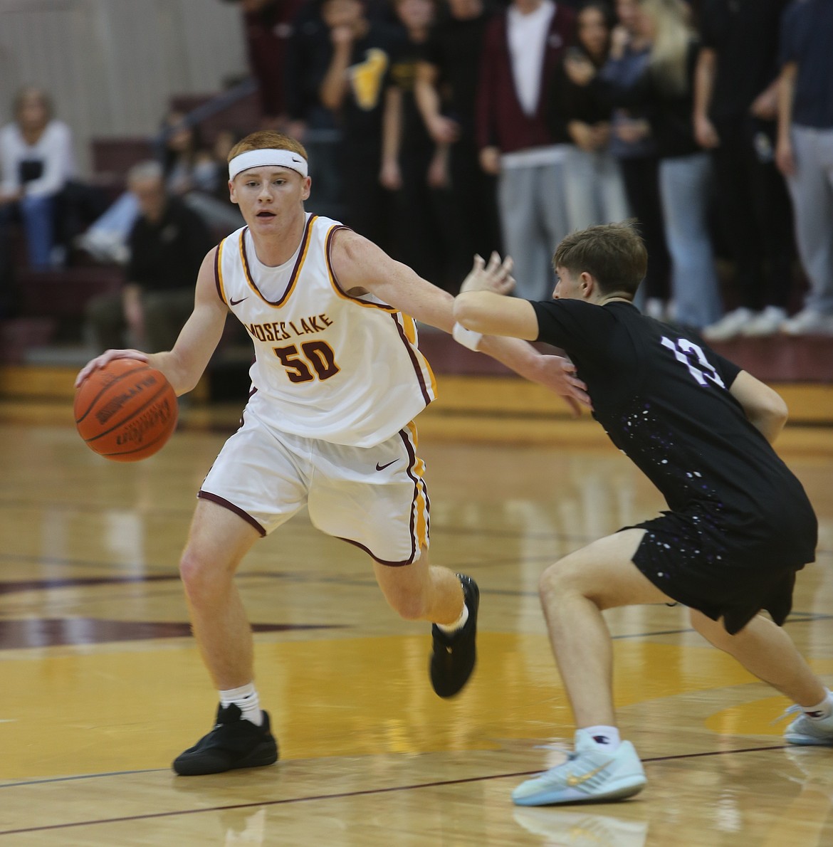 The Mavs’ Kyre Wiltbank (50) drives past a Wenatchee defender during their game Friday. Head Coach Craig Groth said more of their shots started to fall consistently in the second half.