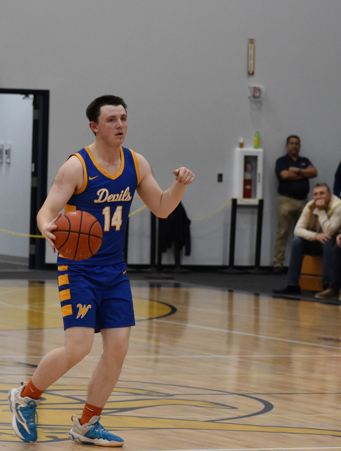 Trevor Sackmann from Wilson Creek begins motioning to one of his teammates so he can pass the ball during Thursday’s game against the Lions.