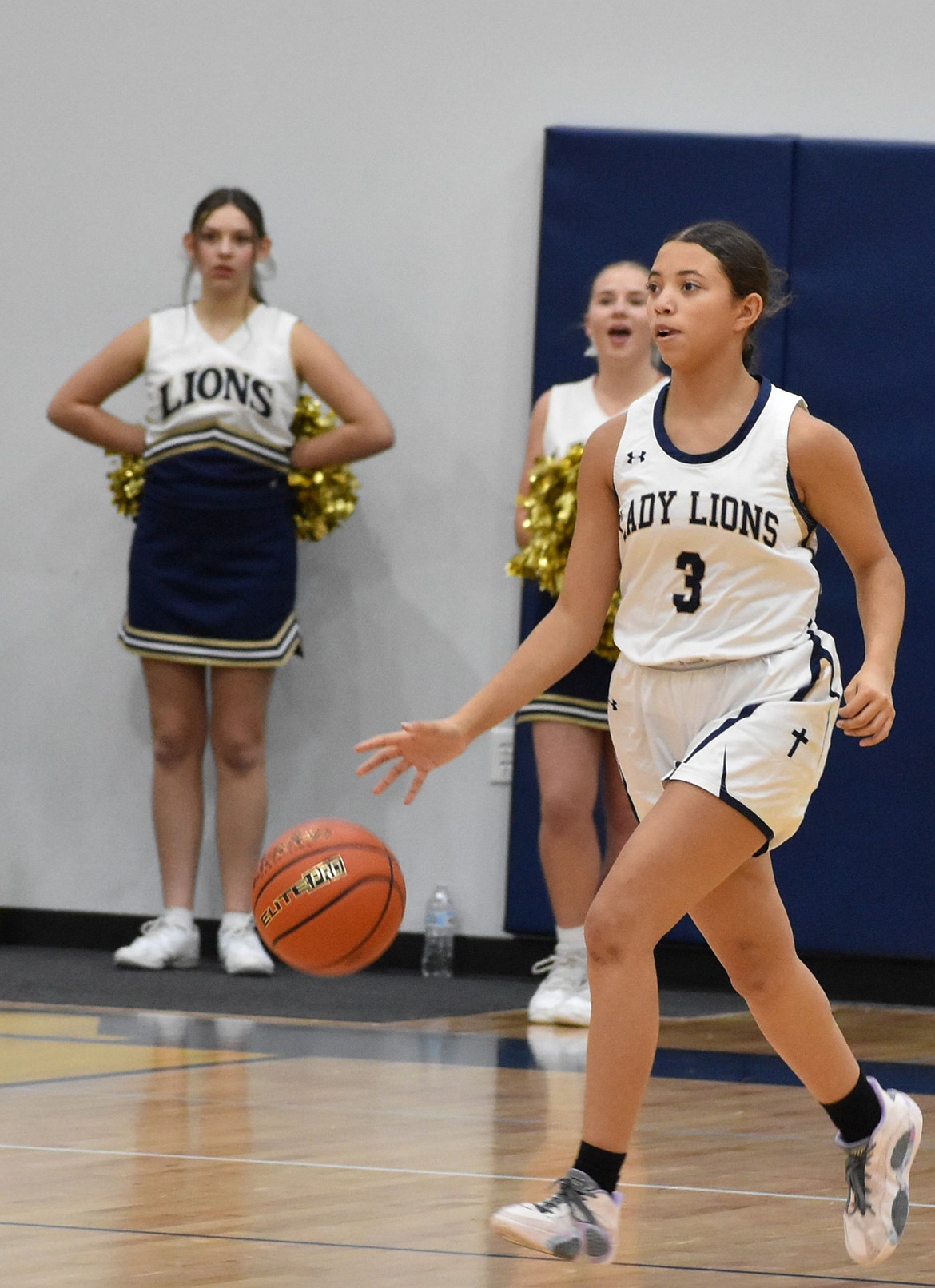 Lions freshman Zoey Ferguson dribbles the ball down the court during Thursday’s game against the Devils after gaining possession.