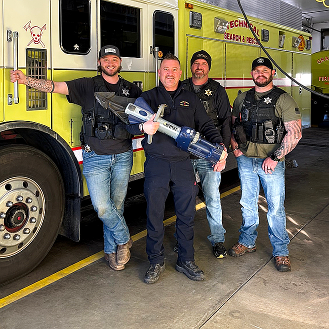 Crime Reduction Team members returned a $20,000 extrication tool to Grant County Fire District 5 after it was stolen during a burglary in August. CRT members from left to right are Deputy Sheriff Ben Smithson, Sgt. Jason Ball and Deputy Sheriff Adam Davis.