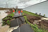 Crews use sandbags to shore up breach in levee near Seattle after failure prompts flood warning