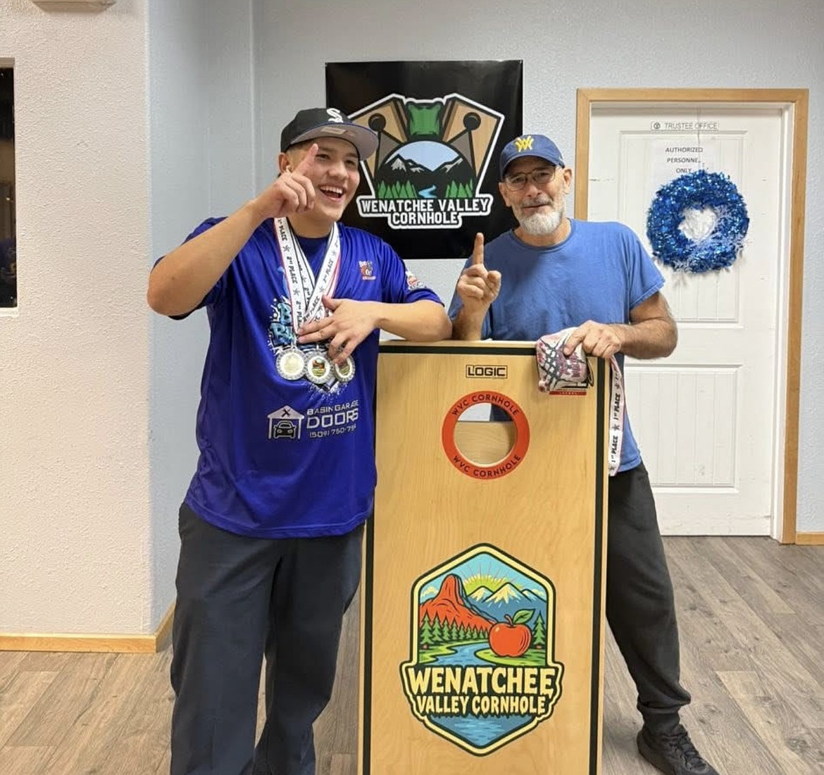 Camryn Barrientoz, left, and his doubles partner Jay Robins took back-to-back titles at the Wenatchee Valley Cornhole tournament last week. Barrientoz is working his way into professional status, he said.
