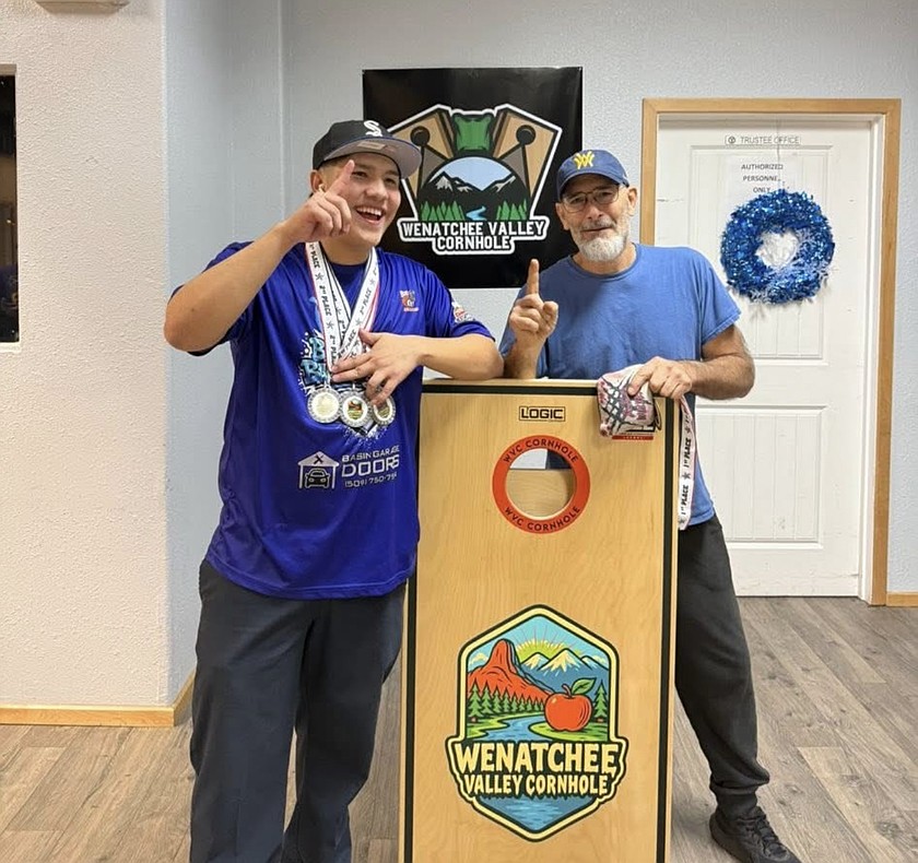 Camryn Barrientoz, left, and his doubles partner Jay Robins took back-to-back titles at the Wenatchee Valley Cornhole tournament last week. Barrientoz is working his way into professional status, he said.