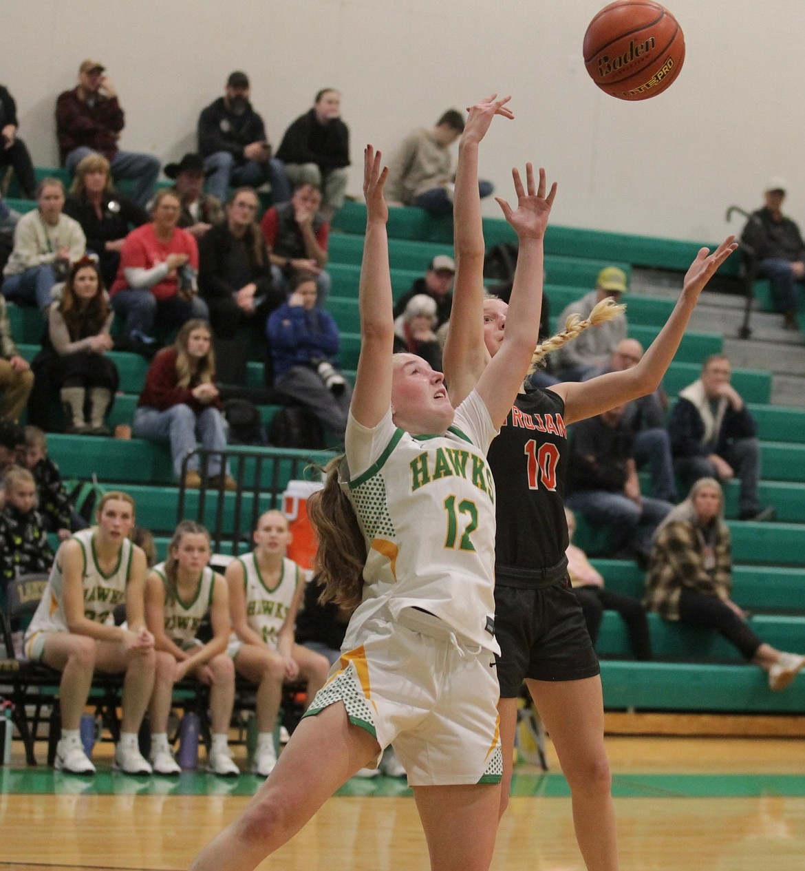 JASON ELLIOTT/Press
Lakeland sophomore guard Kapree Kiefer and Post Falls junior Jaya Felix battle for a rebound during the second quarter of Tuesday's game at Hawk Court in Rathdrum.