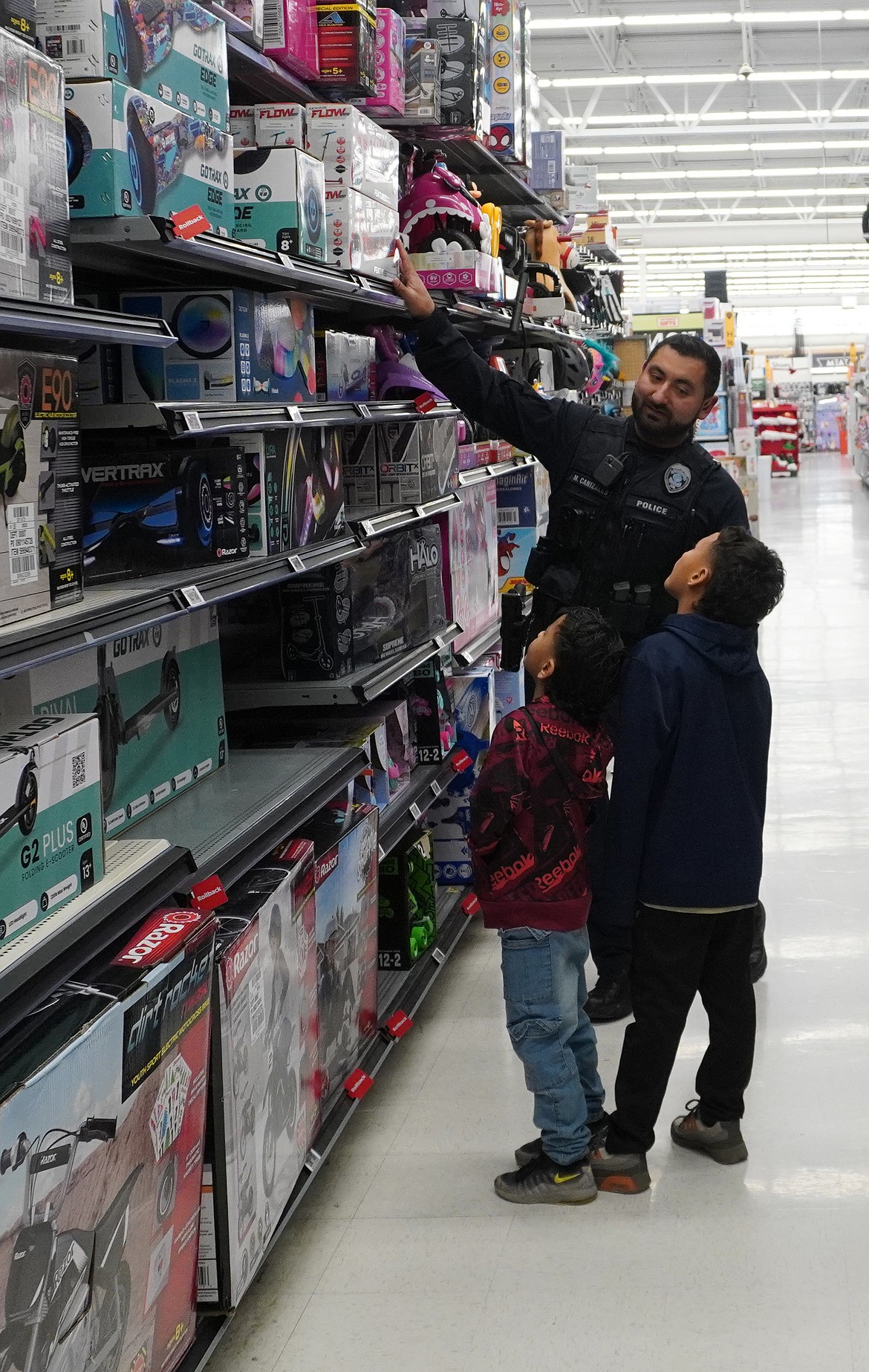 Ephrata Police Officer Marvin Canizales makes some dreams come true at Ephrata’s Shop with a Cop Dec. 11.
