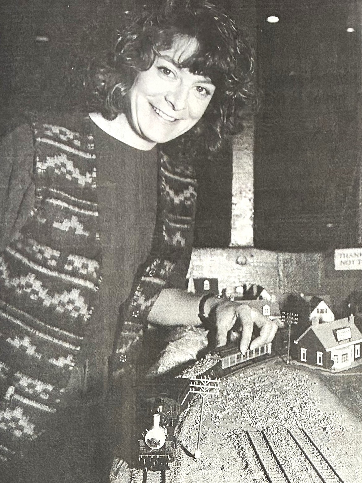 Assistant manager Tori Shelton of the Iron Horse stands by the remaining cars of a decorative train set in 1995.