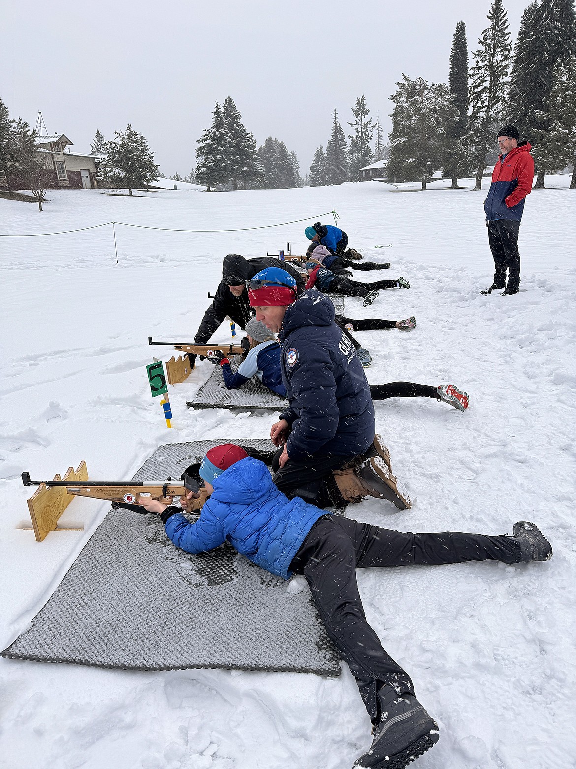 Young participants at biathlon proactice shooting fro the prone position with rifle supports. (Photo provided by GNC)