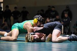 Jacks senior Enrique Rebollo battles against Matthew Galloway in the 165 lb weight class during Wednesday’s match. Rebollo would come out on top to add a victory to the team score.