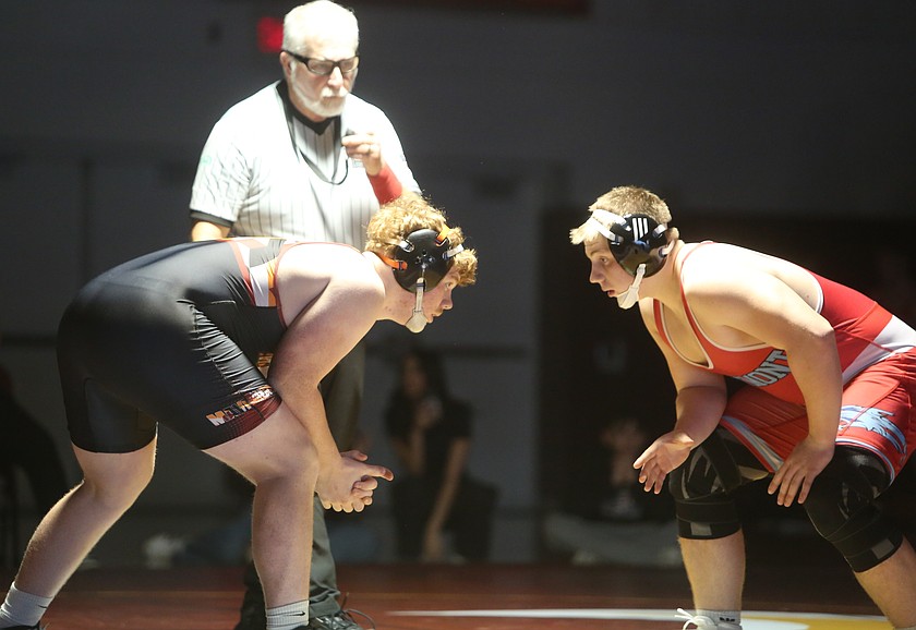 Eli Anderson, left, faces off with his opponent during their Eastmont duel. The Mavericks were victorious over the West Valley Rams 54-24 on Wednesday.