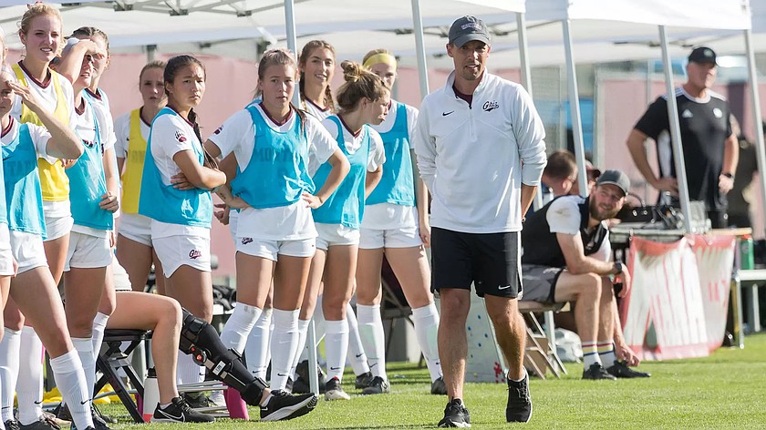 Chris Citowicki, white shirt, walks the sideline during a University of Montana women’s soccer game. Citowicki was named the new head coach of women’s soccer at Washington State.