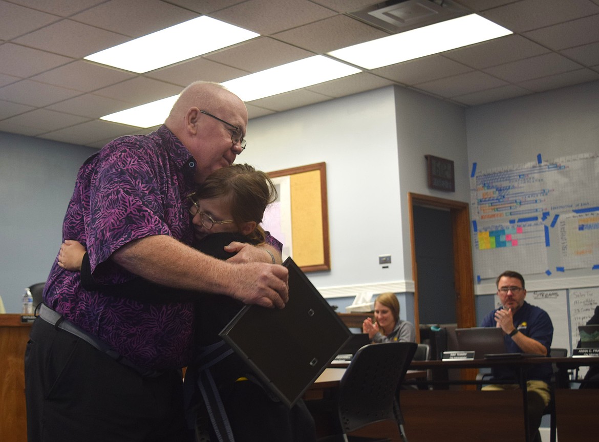 Mayor Bruce Reim accepts a hug from Summer Rocheleau, the young Ephrata resident who has been leading the Pledge of Allegiance at council meetings. She was recognized for her service at Wednesday night’s meeting.