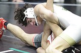 TRI-STATE INVITATIONAL: Post Falls has four in semifinals ... Defending champ Orting in front after first day; Trojans in tie for fourth