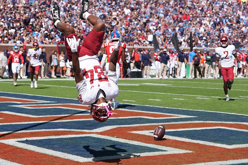 WSU wide receiver Landon Wright does a backflip after scoring a touchdown in a previous game this season. Wright caught a 39-yard touchdown during the Cougar’s bowl win over Utah State.