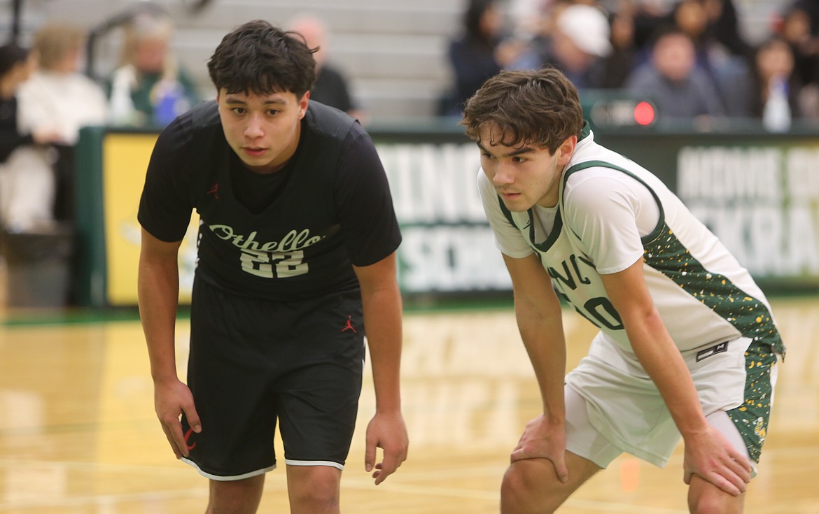 Kayden Baughman (30) presses Kingston Valdez (22) as Othello prepares to pass the ball back into play.