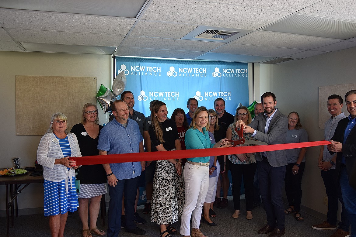 Sue Kane, CEO of NCW Tech Alliance, does the honors at the nonprofit’s Moses Lake Chamber of Commerce ribbon cutting ceremony at the digital organization’s location near Big Bend Community College in late June 2024. Kane was recently appointed to the Washington Board of Education.
