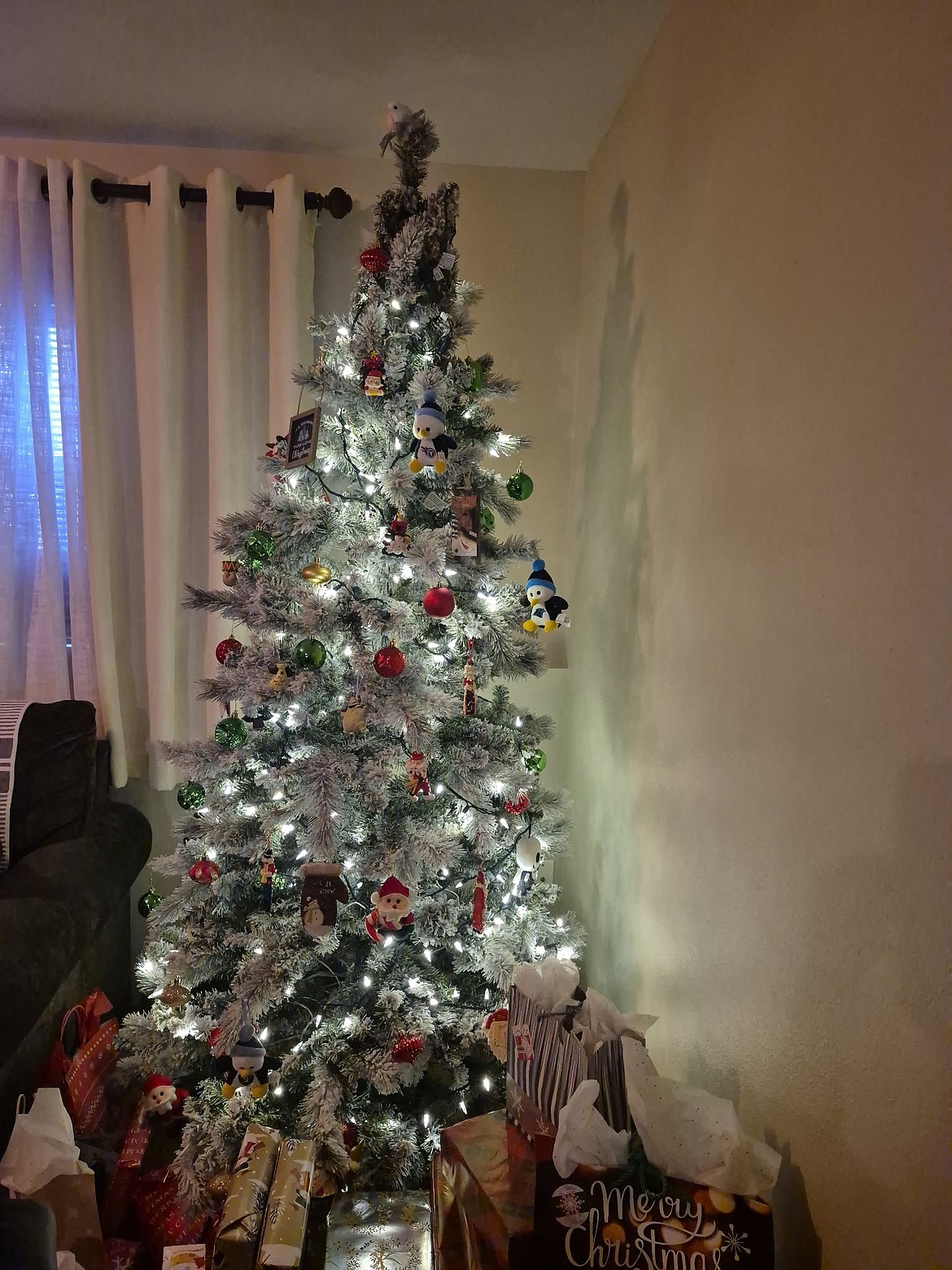 The Perez family Christmas tree sports a bird theme with multiple penguin ornaments and a dove topper. Now if Carmen can just keep Caleb from shaking all the presents under the tree this year.