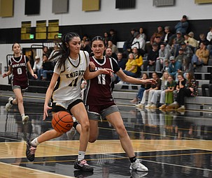 Knights senior Briana Cedillo and Warriors junior Yohary Magana collide as Cedillo goes for the layup during Friday’s matchup between the two teams.