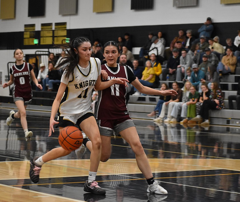Knights senior Briana Cedillo and Warriors junior Yohary Magana collide as Cedillo goes for the layup during Friday’s matchup between the two teams.