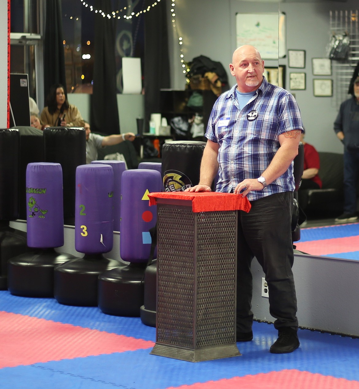Joni’s Angels Ambassador and COO Charlie Hicks gives opening remarks at the Freewind Martial Arts studio. Hicks said martial arts saved his life, and he hopes the Joni’s Angels scholarship will have a similar impact on future students.