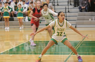Chloe Medina (32) walls up against an Othello player on defense. The Jacks defeated the Huskies 58-54 in an overtime thriller on Saturday.