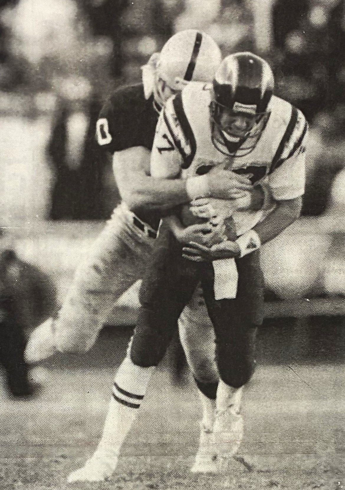 Scott Davis of the Los Angeles Raiders sacks rookie John Friesz in his debut as a starting NFL quarterback in 1990.