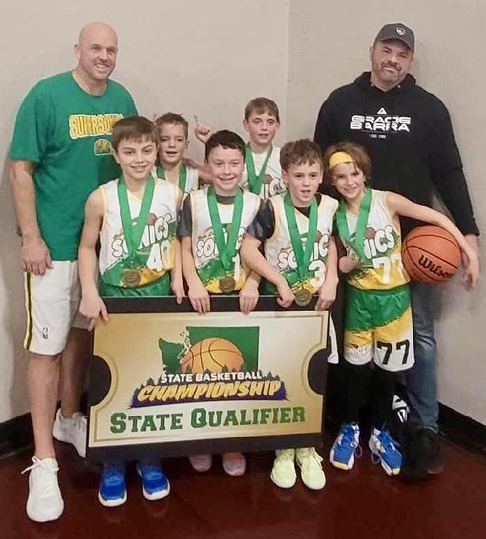 Courtesy photo
The third grade Coeur d'Alene SuperSonics won the championship in the 2025 Santa Slammer basketball tournament at the HoopTown Warehouse in Spokane, beating Sandpoint Future 34-31 in overtime in the championship game. From left are coach Todd Nelson, Ellio Estes, Connor Gregg, Camas Bennett, Cameron Nelson, Henry Mandel, Harry Noel and coach Scott Estes. Not pictured are Kohen Marjes and Archer Toronto.