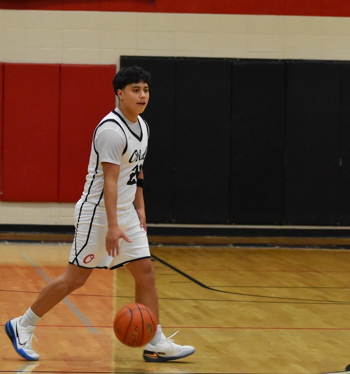 Kingston Valdez from Othello looks down the court for an opening during a previous home matchup. The Huskies have a record of 2-6 and will return to the court in January to play at home the Ephrata Tigers.