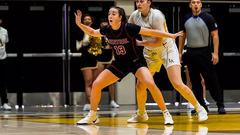 Capri Sims (13) posts up against a California State LA player. Sims was named the Greater Northwest Athletic conference Player of the Week.
