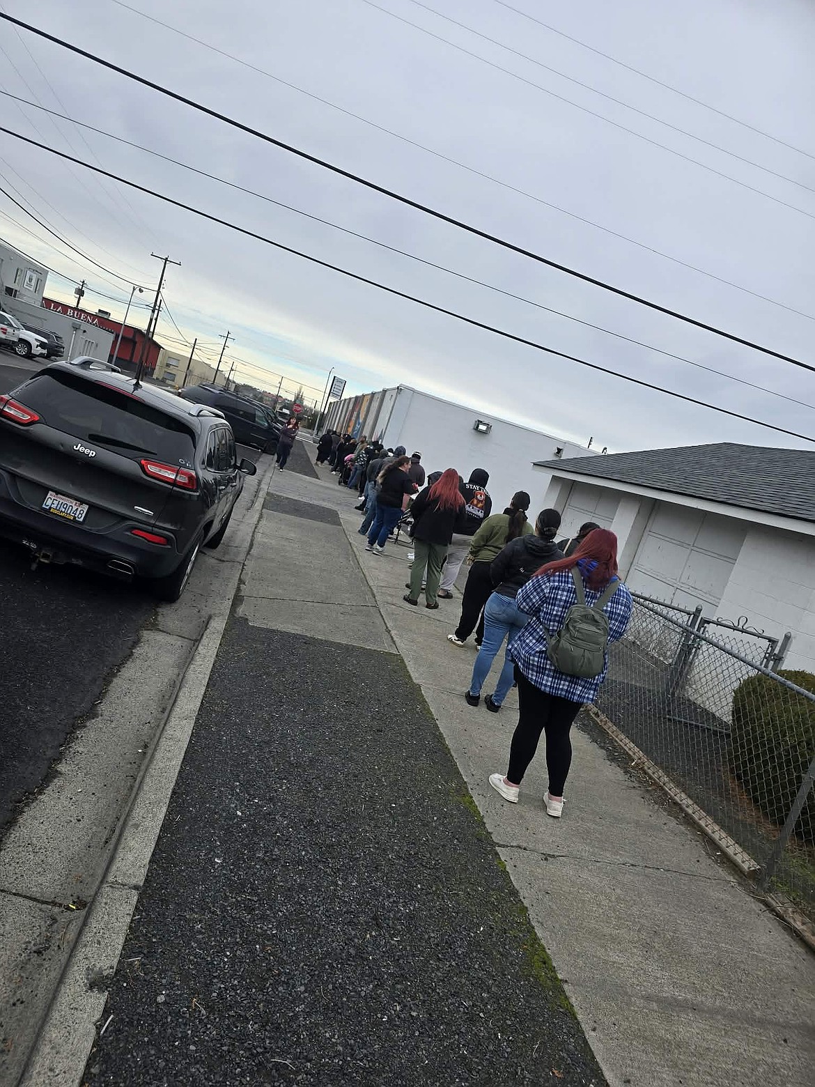 The give-away had a bit of a queue Sunday as parents showed up to get a little help making sure their children had a good Christmas.