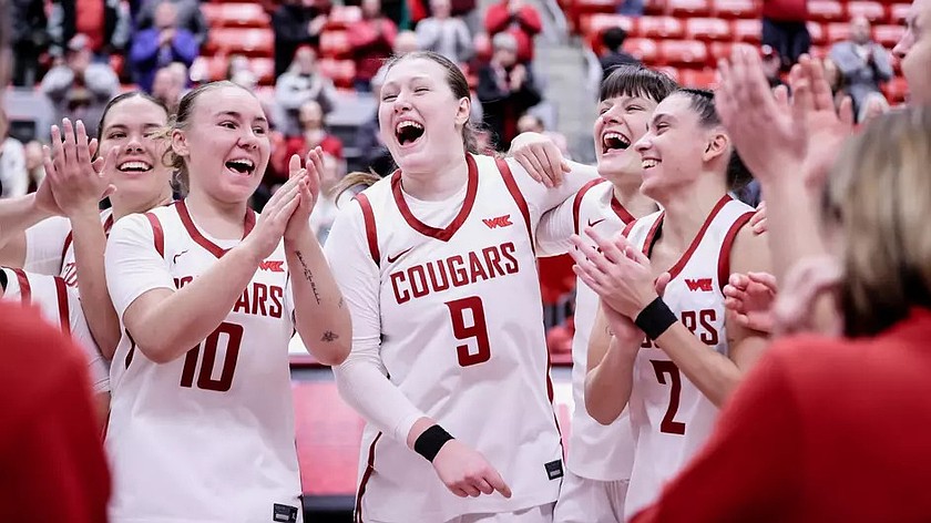 The Washington State Cougars celebrate after earning a close 66-63 win over Pepperdine Sunday. Eleonaora Villa (2) led the team in scoring with 17 points.