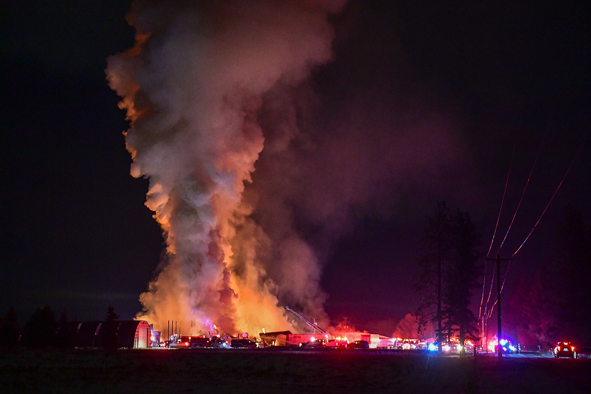 Firefighters respond to a blaze at Montana Timberline Firewood Company on Helena Flats Road on Tuesday, Dec. 30. (Casey Kreider/Daily Inter Lake)