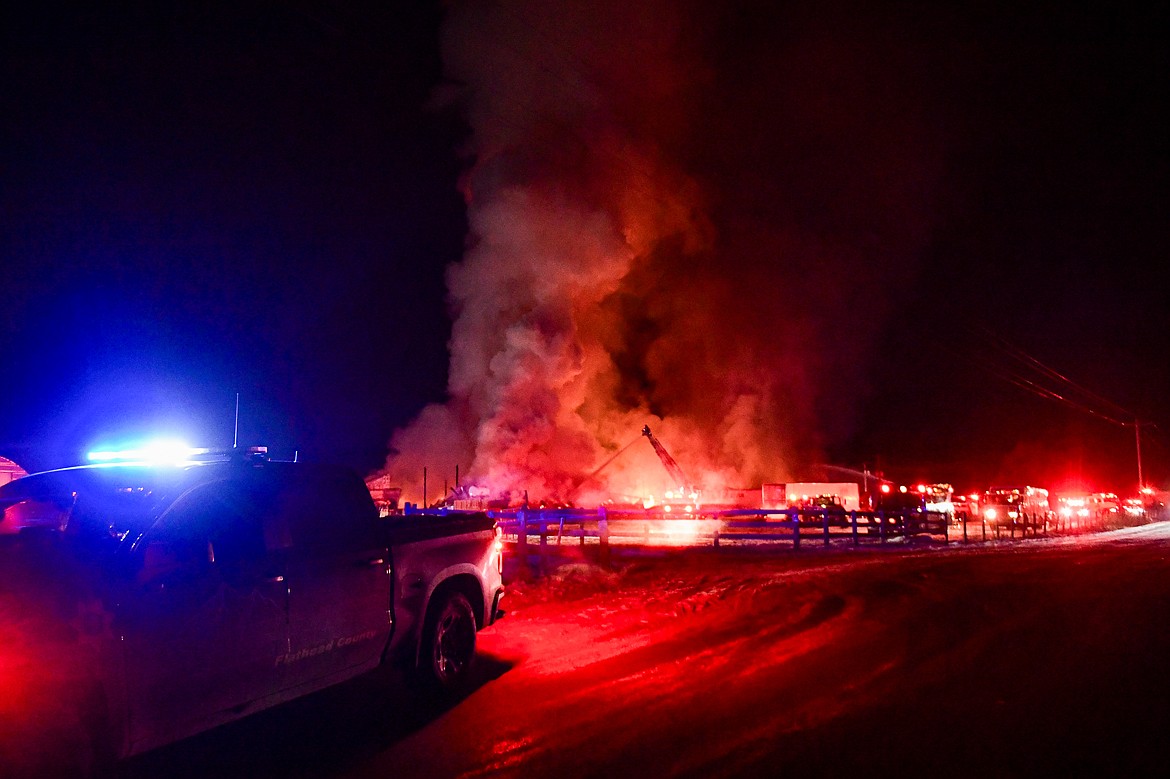 Firefighters respond to a blaze at Montana Timberline Firewood Company on Helena Flats Road on Tuesday, Dec. 30. (Casey Kreider/Daily Inter Lake)