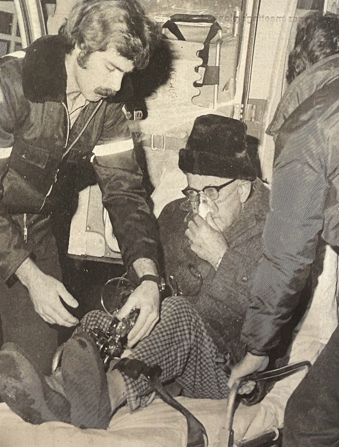 Firefighters treat Lake Tower resident Wes Hamlet during a 1981 fire.