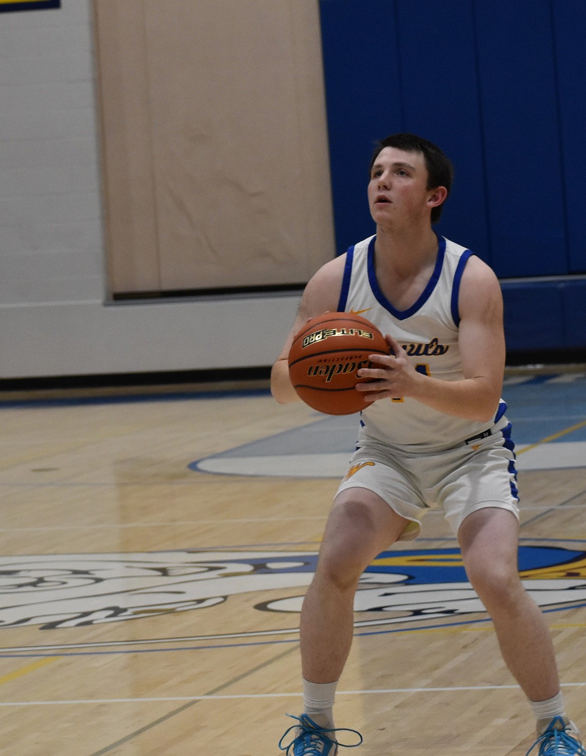 Wilson Creek junior Trevor Sackmann shoots for three in the first quarter during Tuesday’s victory.