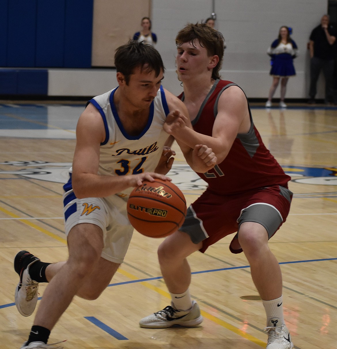 Reece Kane, a senior from Wilson Creek, pushes through the defending Lukas Fletcher from Waterville-Mansfield.