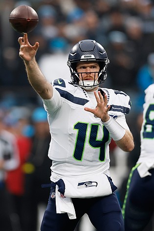 Seattle Seahawks quarterback Sam Darnold passes against the Carolina Panthers during the second half of an NFL football game, Sunday, Dec. 28, 2025, in Charlotte, N.C.