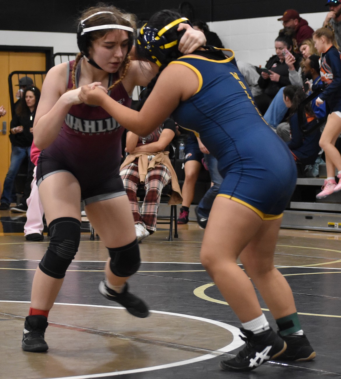 Wahluke’s Adriann Lovejoy Mitchell and Sofia Encarnacion Leon from Wapato lock together trying to topple the other during one of the 140-lb matches.